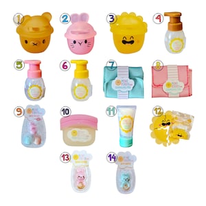 May include: A collection of baby care products, including bottles, a changing pad, and bath toys. The items are in various colors, such as yellow, pink, and blue, and feature cute animal designs. The brand name "Mini Firsts" is visible on several items.