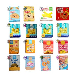May include: Sixteen miniature food product boxes labeled with numbers one through sixteen, featuring colorful cartoon illustrations of tacos, pretzels, pasta shapes, crackers, bread crumbs, cereal, and chocolate rings with smiling faces.