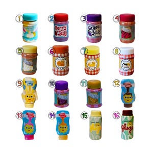 May include: A collection of sixteen miniature food containers, including jars and squeeze bottles, each labeled with names like Marshmallow Fluff, Berry Jelly, Grape Jelly, Spread, Pie Filling, Condensed Milk, Chocolate Syrup, and Glaze.