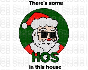 May include: A green circle with a cartoon image of Santa Claus wearing sunglasses and a red hat. The text "There's some HOS in this house" is below the circle.