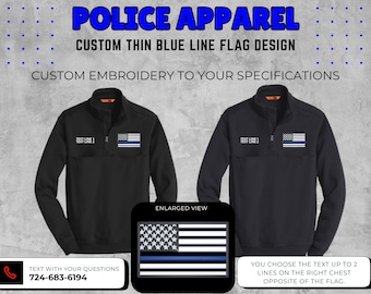 May include: Black police apparel with a custom thin blue line flag design. The image shows two black jackets with a flag and text. The text says "TEXT LINE 1 TEXT LINE 2". The image also includes the text "CUSTOM EMBROIDERY TO YOUR SPECIFICATIONS".