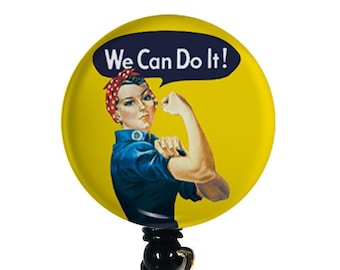 May include: A yellow and blue retractable badge holder with a round, printed image of a woman with her fist raised and the text "We Can Do It!"