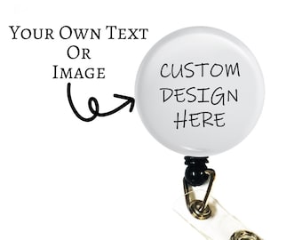 May include: White retractable badge holder with a round, white, blank disc. The disc has the text "CUSTOM DESIGN HERE" written on it.  The text "YOUR OWN TEXT OR IMAGE" is written above the disc.