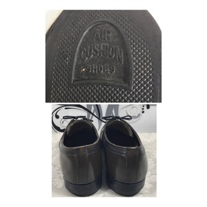 May include: A pair of brown leather lace-up shoes with a black rubber sole. The sole has the text "Air Cushion Shoes" embossed on it.
