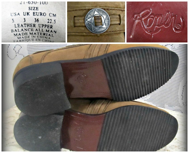 May include: Brown leather boots with a decorative metal buckle on the top. The boots have a rubber sole with a tread pattern. The boots are labeled "Rapers" and have a size tag that reads "USA 5 UK 3 EURO 36 CM 22.5".