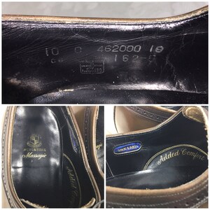 May include: Close-up of the interior of a brown leather shoe with black stitching. The insole is black with the text "Weyenberg Massagic" and "Added Comfort" printed in gold. A blue label with the text "Silk Label" is visible.