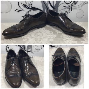 May include: Four brown leather oxford shoes with wingtip detailing and lace-up closures. The shoes have a brogue pattern and a polished finish.
