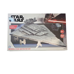May include: A Star Wars Imperial Star Destroyer set, featuring a detailed model of the iconic spaceship. The box displays the Star Wars logo, the ship, and the text "Imperial Star Destroyer Set". Includes 342 pieces and is for ages 8+.