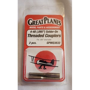 May include: A package of two silver 4-40 (.095") solder-on threaded couplers for model airplanes. The package is red and white with the Great Planes logo and the product description. The couplers are designed to fit .095" wire/cable.