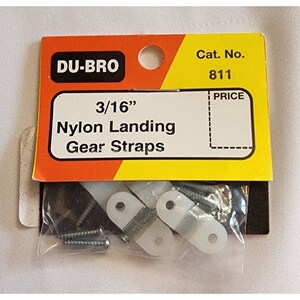May include: A package of Du-Bro 3/16" nylon landing gear straps. The package contains two white nylon straps and four silver screws. The package is labeled with the Du-Bro logo and the product name and size. The package also includes a price tag.