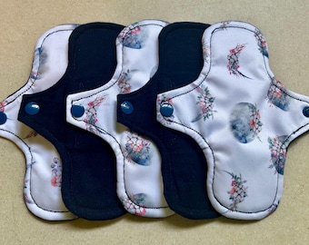 Toallas sanitarias de tela de 18 cm (7 pulgadas), de absorción moderada, con núcleo de vellón orgánico, lavables y reutilizables. Precio por unidad.