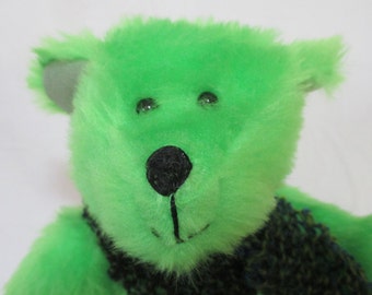 PATRICK: A cheerful bright green fuzzy teddy bear.