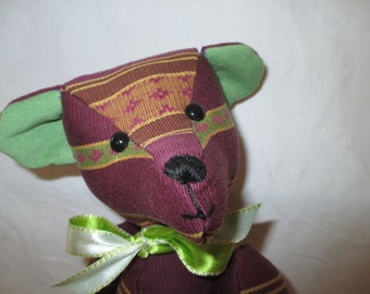 SUNDAY; A sophisticated striped bear with a pleasant smile.