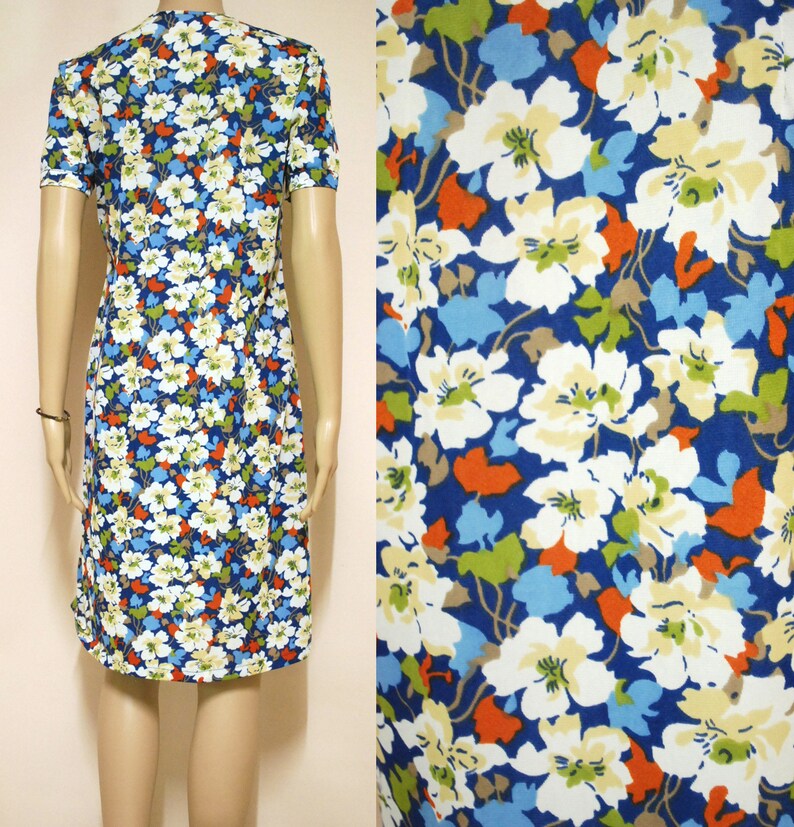 May include: A blue and white floral print dress with short sleeves. The dress has a fitted bodice and a slightly flared skirt.