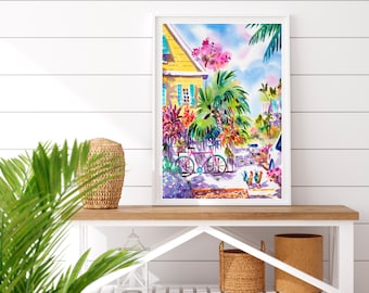 Può includere: Stampa ad acquerello incorniciata di una scena tropicale con una casa gialla, una bicicletta rosa e una vegetazione lussureggiante. L'opera d'arte, incorniciata in bianco, utilizza una vivace tavolozza di blu, rosa e verdi, evocando una giornata di sole.