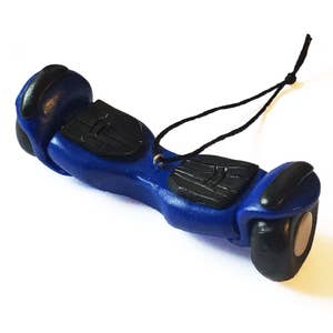 May include: A blue and black miniature hoverboard ornament with a black string for hanging. The small, detailed replica features a blue body with black footpads and wheels, and a small gold-colored ring.