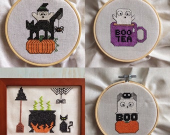 May include: Four embroidery hoops with Halloween-themed cross-stitch designs. The first hoop features a black cat with a witch's hat, holding a pumpkin. The second hoop features a ghost in a mug with the text "Boo-ter". The third hoop features a black cat with a pumpkin. The fourth hoop features a ghost with a pumpkin and the text "Boo".
