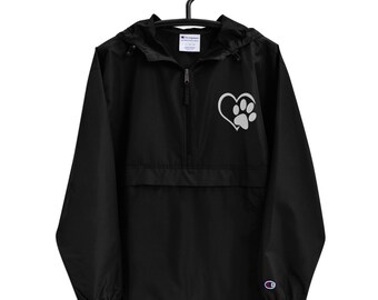 May include: Black Champion brand windbreaker jacket with a zipper closure and a grey paw print inside a heart on the left chest.