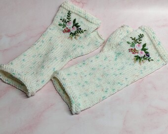 white wrist warmers with embroidery