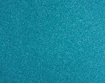 May include: A close-up of a teal blue glitter fabric. The fabric has a fine, even texture and a sparkly finish.