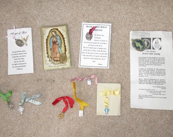 10 Catholic medals on cards or ribbons