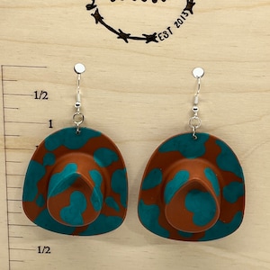 Cowboy hat with custom spots.  Brown and Teal