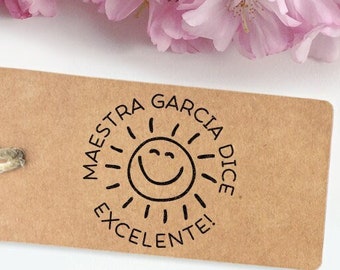 May include: A brown paper tag with a black stamp that says "Maestra Garcia Dice Excelente!" with a smiling sun graphic.