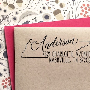May include: A brown paper return address label with a black outline of the state of Tennessee and the text "Anderson" in cursive script. The address is "7321 Charlotte Avenue Nashville, TN 37209".