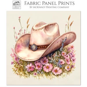May include: Fabric panel print featuring a watercolor illustration of a cowboy hat surrounded by pink and purple flowers. The hat is light pink with a brown band and a decorative buckle. The text "Fabric Panel Prints" is visible.