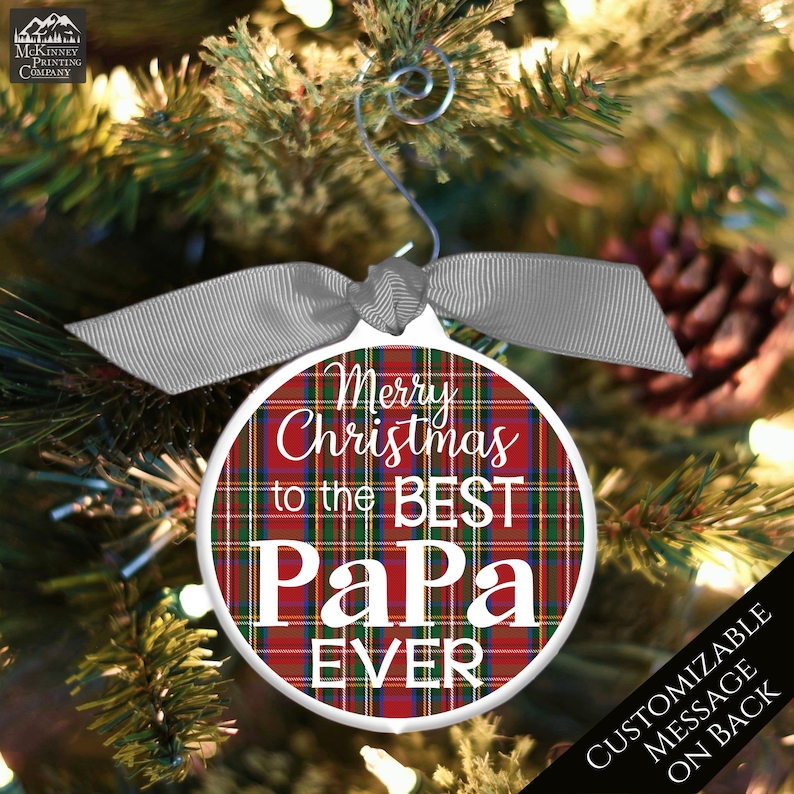 May include: Red and green plaid Christmas ornament with the text "Merry Christmas to the Best Papa Ever".