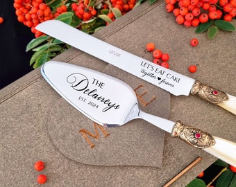 Wedding Cake Cutting Set with Ivory Pearl Handle -  Server and Knife Cutter Set, Antique Gold Washed Metal Ring with a Red Stone Decoration