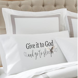 May include: White pillow with a grey border and the text "Give it to God and go to sleep" with a white dove graphic.