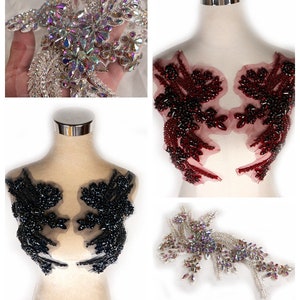 May include: Four different beaded applique embellishments for clothing or crafts. The appliques are in the shapes of flowers and leaves. The colors are black, red, and iridescent.