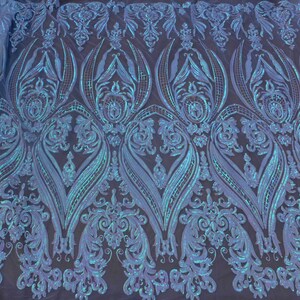 May include: Teal blue iridescent sequins on a mesh fabric with a damask pattern.