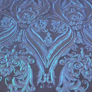 May include: White iridescent sequins on a mesh fabric with a damask pattern.
