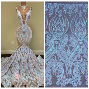 May include: A white iridescent sequined fabric with a floral pattern. The fabric is shown on a dress and as a separate piece.