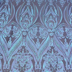 May include: A light blue iridescent fabric with a damask pattern. The fabric is made of sequins and mesh.