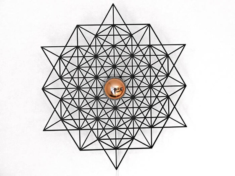 May include: A black metal geometric wall sconce with a round, copper-colored light fixture in the center.