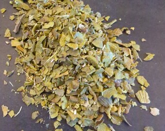May include: A pile of dried green and brown herbs, likely for cooking or herbal tea.
