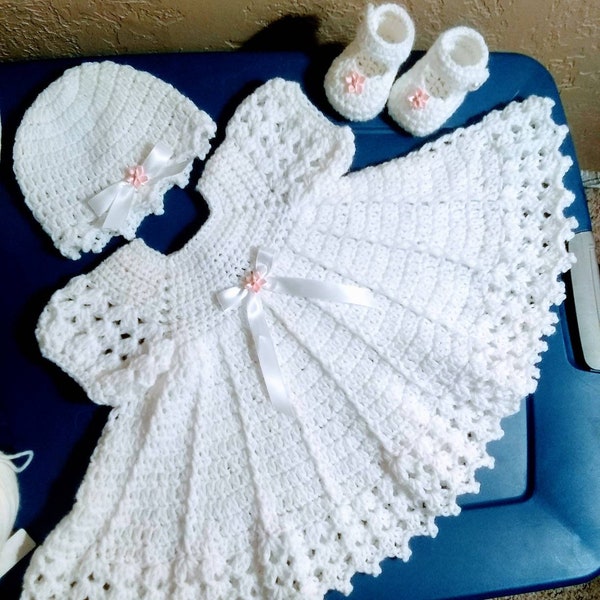 Pretty white crochet baby dress outfit, comes with hat and shoes, the ribbon and roses color may be different.