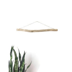 May include: A handmade wooden sign with the text "Welcome" in a playful font. The sign features a distressed finish and a simple, rustic design, perfect for a front door or entryway. The sign is rectangular and appears to be made of reclaimed wood.