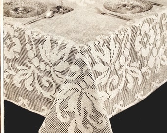 May include: A white crocheted tablecloth with a floral pattern. The tablecloth is about 80 x 100 inches.