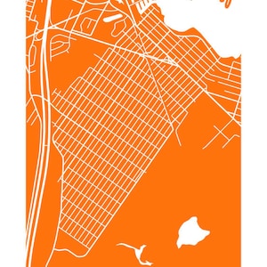 May include: An orange and white map of Beachwood, Ohio. The map features a grid of streets and roads, with a coastal area and the text "BEACHWOOD" at the bottom. The design is minimalist and graphic, suitable for wall art or home decor.
