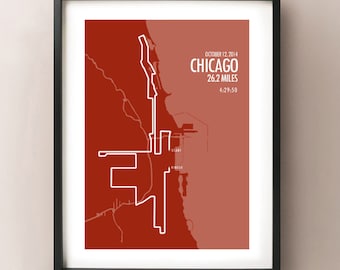 May include: Framed print depicting the Chicago Marathon route in white on a reddish-brown backdrop. Text includes "CHICAGO 26.2 MILES" and race details. The print is enclosed within a black frame, suitable for wall display.