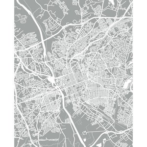 May include: A gray and white map print of Columbia, with the city name at the top. The map features detailed street layouts, roads, and waterways, creating a modern, minimalist design.