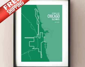 May include: A framed print showing a green and white graphic of the Chicago marathon route. The text reads "October 9, 2022 Chicago 26.2 Miles 4:15:22". The print is in a black frame.