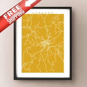 May include: Framed print featuring a map of Sarnano in white lines against a mustard yellow background. The print is in a black frame. The words "SARNANO" are at the top. A red banner with the words "FREE SHIPPING" and a white arrow is in the upper left corner.