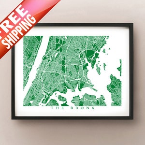 May include: A framed print featuring a detailed green and white map of The Bronx, New York City. The map highlights streets, parks, and waterways. The text "THE BRONX" is printed at the bottom. The frame is black.