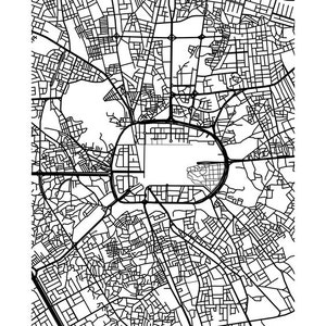 May include: A black and white map of Medina, featuring a detailed street layout. The city's name is printed in a clean, sans-serif font at the bottom. The map showcases a complex network of roads and urban planning.