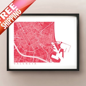 May include: Framed print of the Valencia, Spain city map in a vibrant red hue. The map features detailed street layouts and is set against a white background. The word "Valencia" is printed at the bottom.